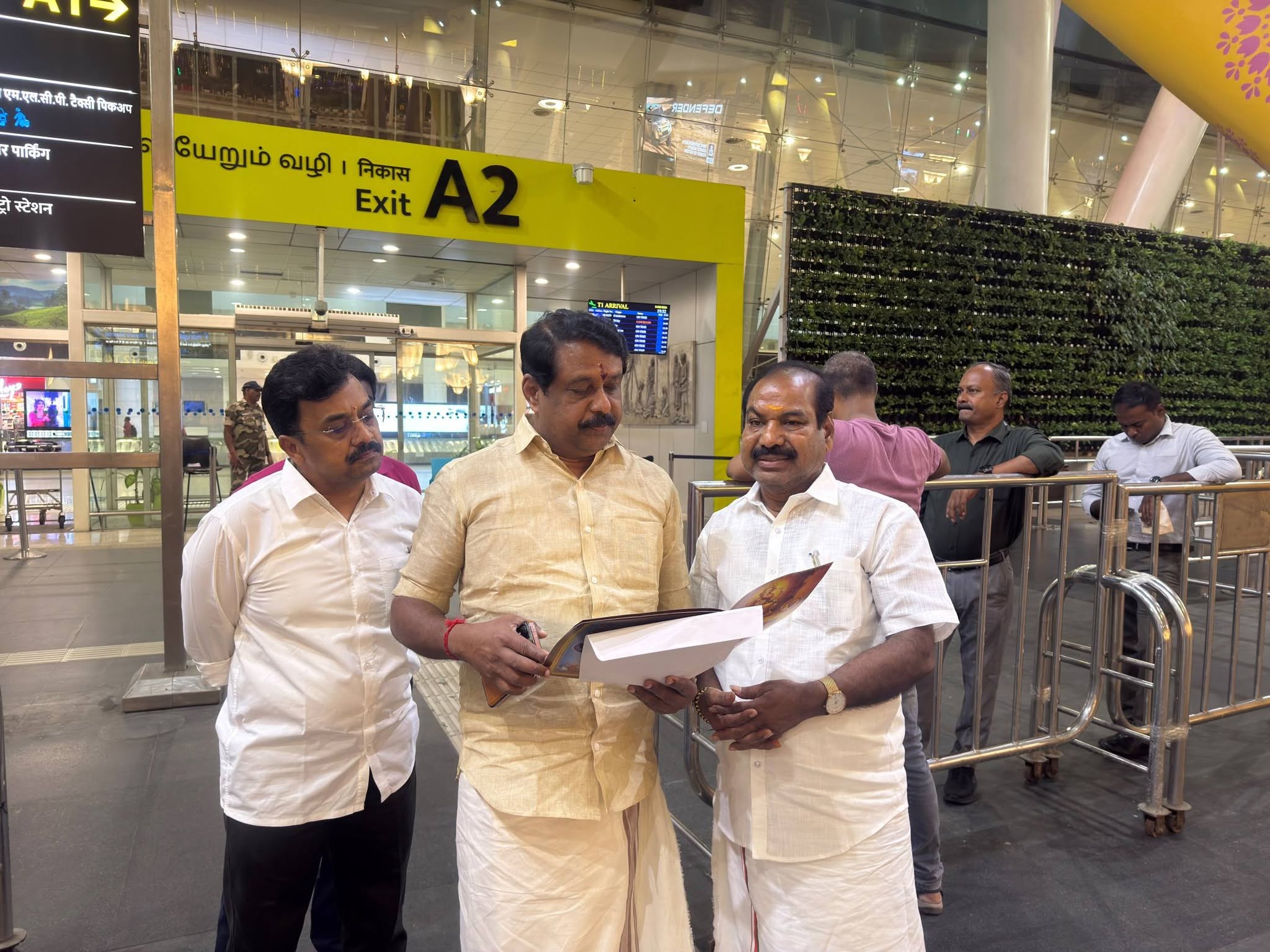 Briefing a senior leader on arrival in Chennai, alongside fellow party colleagues.